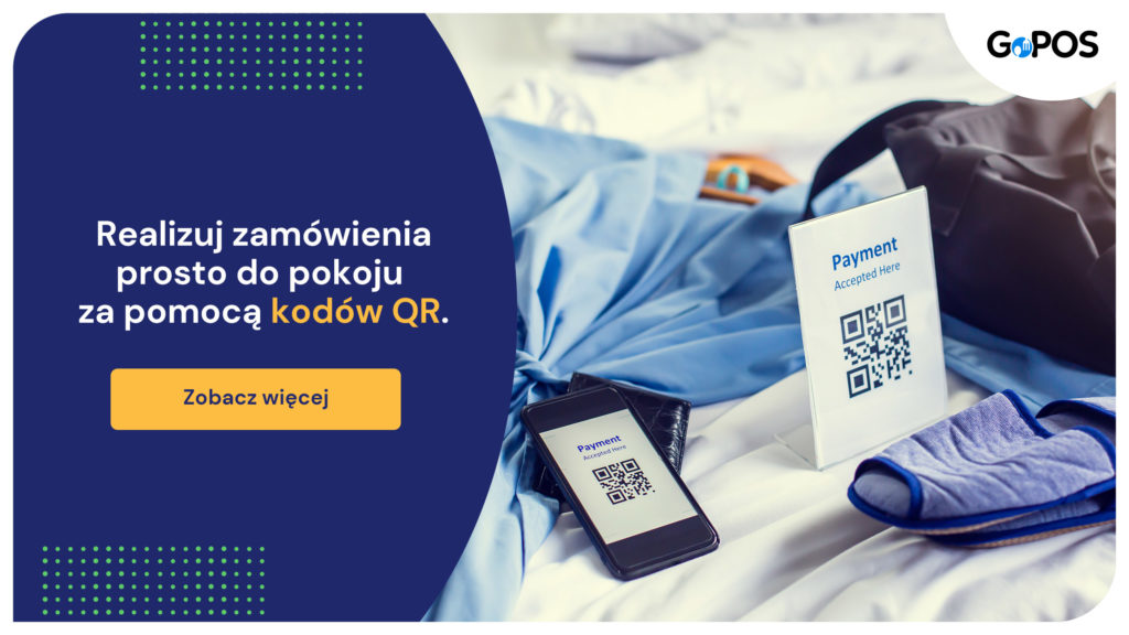 Smartfon oraz kod qr umieszczony w pokoju hotelowym